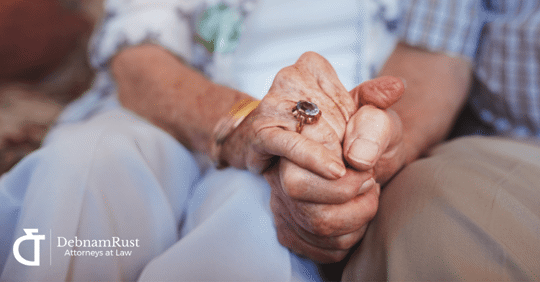 older couple holding hands