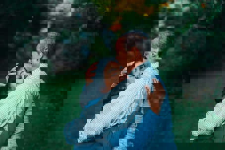 Family hugging after the passing of a love one.