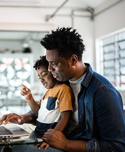 Mother with son looking at a laptop screen