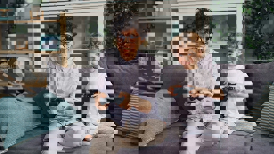 Parent playing video games with child